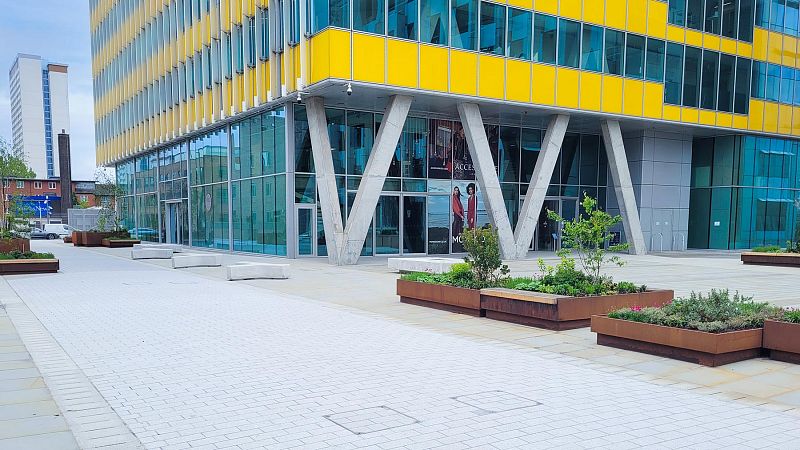 Custom cast seating beneath the Yelllow Building